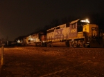 Q273-09 with a 4-axle leader sits in the siding near CP-10 at 9: 25 PM